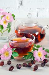 Cup and teapot of rose hip tea
