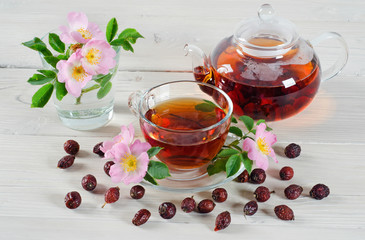 Teapot and cup of rose hip tea
