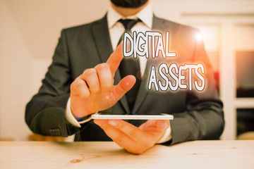 Word writing text Digital Assets. Business photo showcasing has value and can be owned but has no physical presence Male human wear formal clothes present presentation use hi tech smartphone