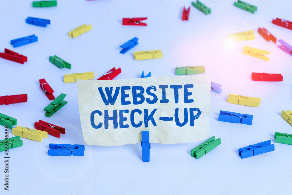 Fototapete Handwriting text writing Website Check Up. Conceptual photo an examination of a website to see if something is in order Colored clothespin papers empty reminder white floor background office