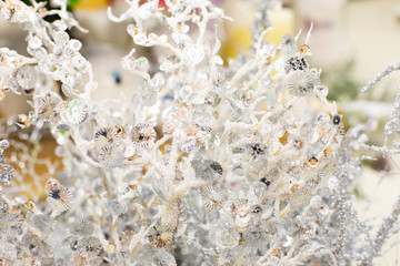 Abstract defocus white magical coral branch decoration. Shiny sparkling bright fairytale coral branch with sparkles and crystals, backdrop background for design