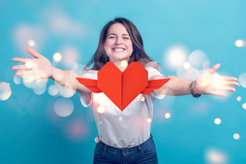 Smiling woman and heart with wings