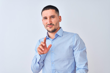 Young handsome business man standing over isolated background disgusted expression, displeased and fearful doing disgust face because aversion reaction. With hands raised. Annoying concept.