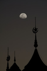 silhouette of muslim mosque dome with half moon on twilight background.concept for ramadan and prayer time background