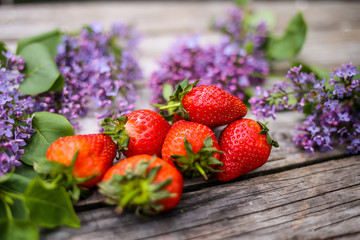 Morning beverage in the garden with flowers, fruit and tea