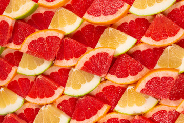 Naklejka na ściany i meble Pomelo and grapefruit slices background.