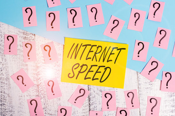 Conceptual hand writing showing Internet Speed. Concept meaning the rate which internet connection is able to move or operate Crumbling papers with thick cardboard on the wooden table