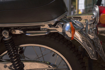 vintage motorbike turn signal and wheel