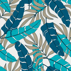 Trendy seamless tropical pattern with bright blue plants and leaves on a delicate background. Hawaiian style. Beautiful print with hand drawn exotic plants.  Summer colorful hawaiian.