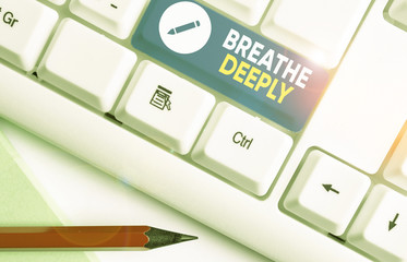 Conceptual hand writing showing Breathe Deeply. Concept meaning to take a large breath of air into...