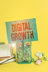 Obraz premium Text sign showing Digital Growth. Business photo showcasing use of digital technology to solve traditional problems Trash bin crumpled paper clothespin empty reminder office supplies yellow