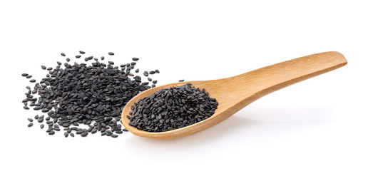 black sesame in  wood spoon isolated on white background