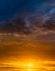 Fantastic clouds at sunrise, vertical panorama