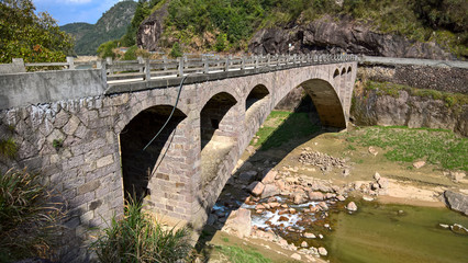 Fototapeta premium old stone bridge over the river