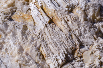 Close-up big nice crystals of iceland spar in the rock of Cape Alchak, surroundings of resort Sudak...