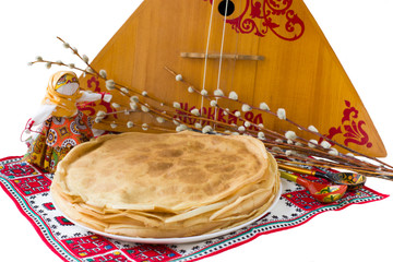 Background with pancakes, textile doll, pussy-willow and balalaika isolated on white for Maslenitsa...