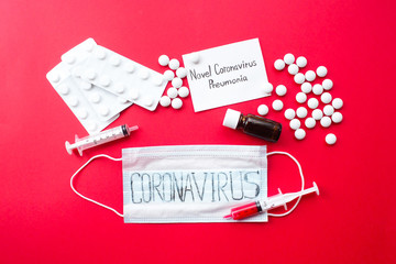  Surgical mask protective mask  with text coronavirus,  pills and  syringe with blood. Chinese...