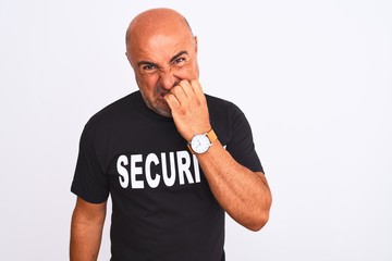 Middle age safeguard man wearing security uniform standing over isolated white background looking stressed and nervous with hands on mouth biting nails. Anxiety problem.