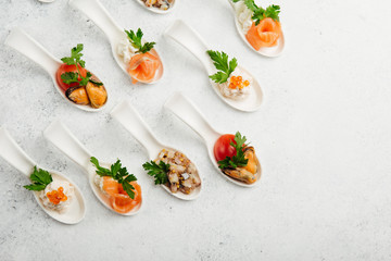 portioned snacks canapes and sandwiches with meat, cheese and vegetables