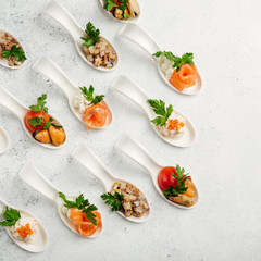 portioned snacks canapes and sandwiches with meat, cheese and vegetables