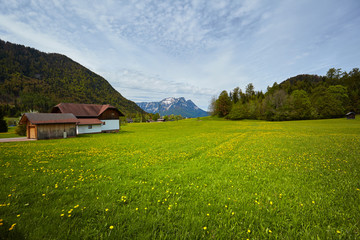 Beautiful landscape of valley in Alpine mountains, small houses in Seefeld, rural scene, majestic picturesque view in sunny day