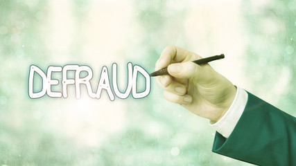 Writing note showing Defraud. Business concept for to trick or cheat someone or something in order...