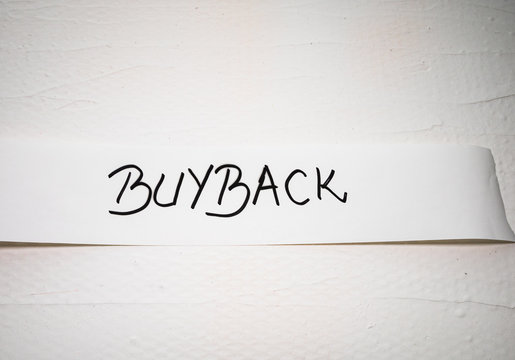 Writing buyback on white label on white background.