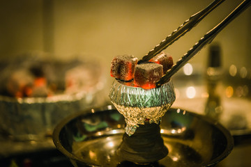 The process of burning shisha.
Strong close-ups, colorful frames with lots of smoke. The dynamics of sparks.