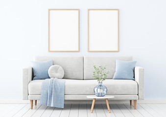 Poster mockup with two vertical wooden frames hanging on the wall in living room interior with sofa, blue pillows and branches in vase on empty background. 3D rendering, illustration.