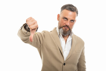 Naklejka premium Portrait of man wearing smart casual clothes showing dislike gesture