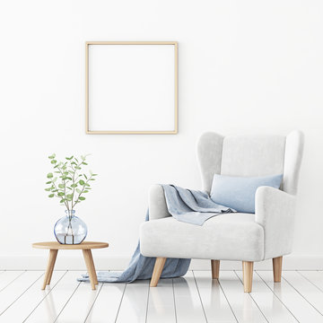 Poster mockup with square frame hanging on the wall in living room interior with armchair, blue pillow and branches in vase on empty white background. 3D rendering, illustration.