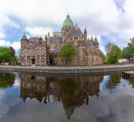 Fototapeta na wymiar The St Bavo cathedral in Haarlem city reflected in the Leidsevaart