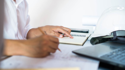 Structural design engineers work in building structure analysis.Closeup video Insturments and office for designer.drawings and computer on the table.Heavy industry business Concept Construction