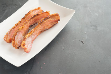 slice of bacon on plate
