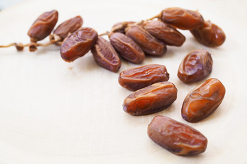 dried date palm fruit on wooden