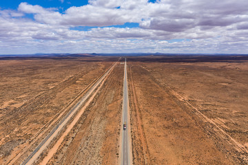Fototapeta na wymiar A lonely truck on the Barrier Highway between the small settlements of Yunta and Nackara in South Australia