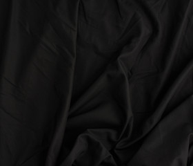 Obraz premium texture of black cotton fabric with waves, full frame
