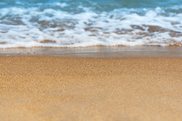 Soft sea wave on sandy beach. Soft focus