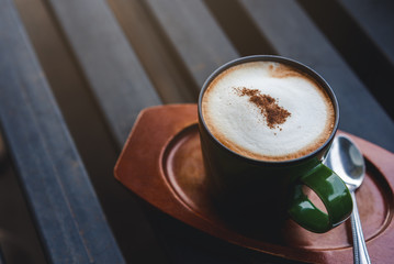 Hot a cup of coffee mocha latte on iron table