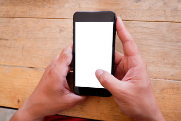 Mockup picture of business man’s hands holding smart phone with white blank screen in modern place.