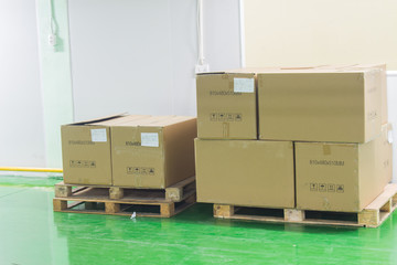 Fototapeta premium The boxes on pallet in the factory. soft focus