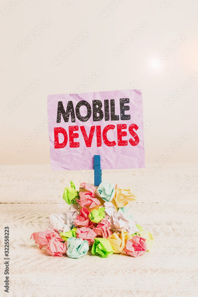 Aufkleber writing note showing mobile devices. business concept for portable computing device such as a smartp