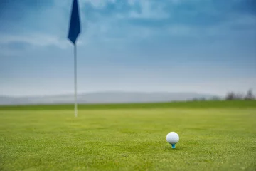 Fototapete Rund golf ball on green © edojob