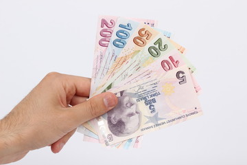 Turkey handful of paper money on a white background