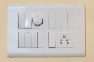 Modern modular switchboard with on/off switch, 3 pin socket and fan regulator.
