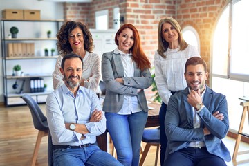 Group of business workers smiling happy and confident. Posing together with smile on face looking at the camera at the office