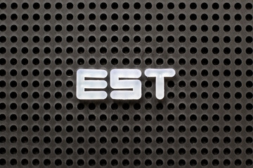 Black color pegboard with white letter in word est