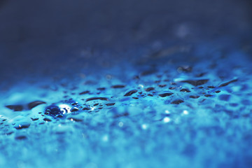 water drops on a blue background. Abstract blue background. Water drops on glass.