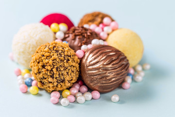Festive chocolates on a light blue background with sugar decorations