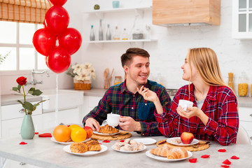 Medium shot couple smiling indoors